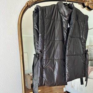 Black vests with tie sides